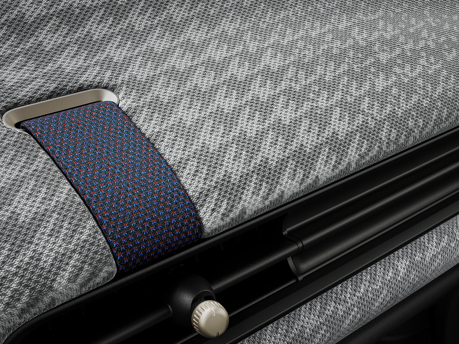 Närbild av den 2D-stickade instrumentpanelen i en MINI Cooper.