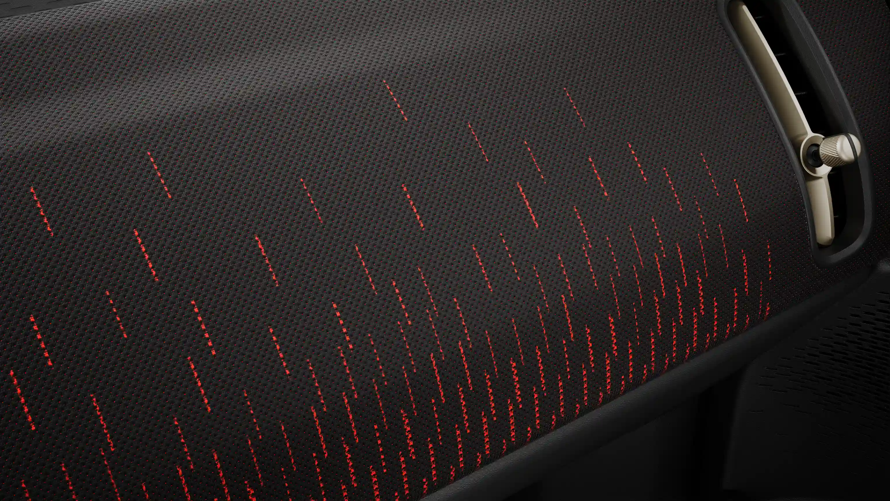 Vy över instrumentpanelen i rött och svart på helt elektriska MINI Countryman JCW